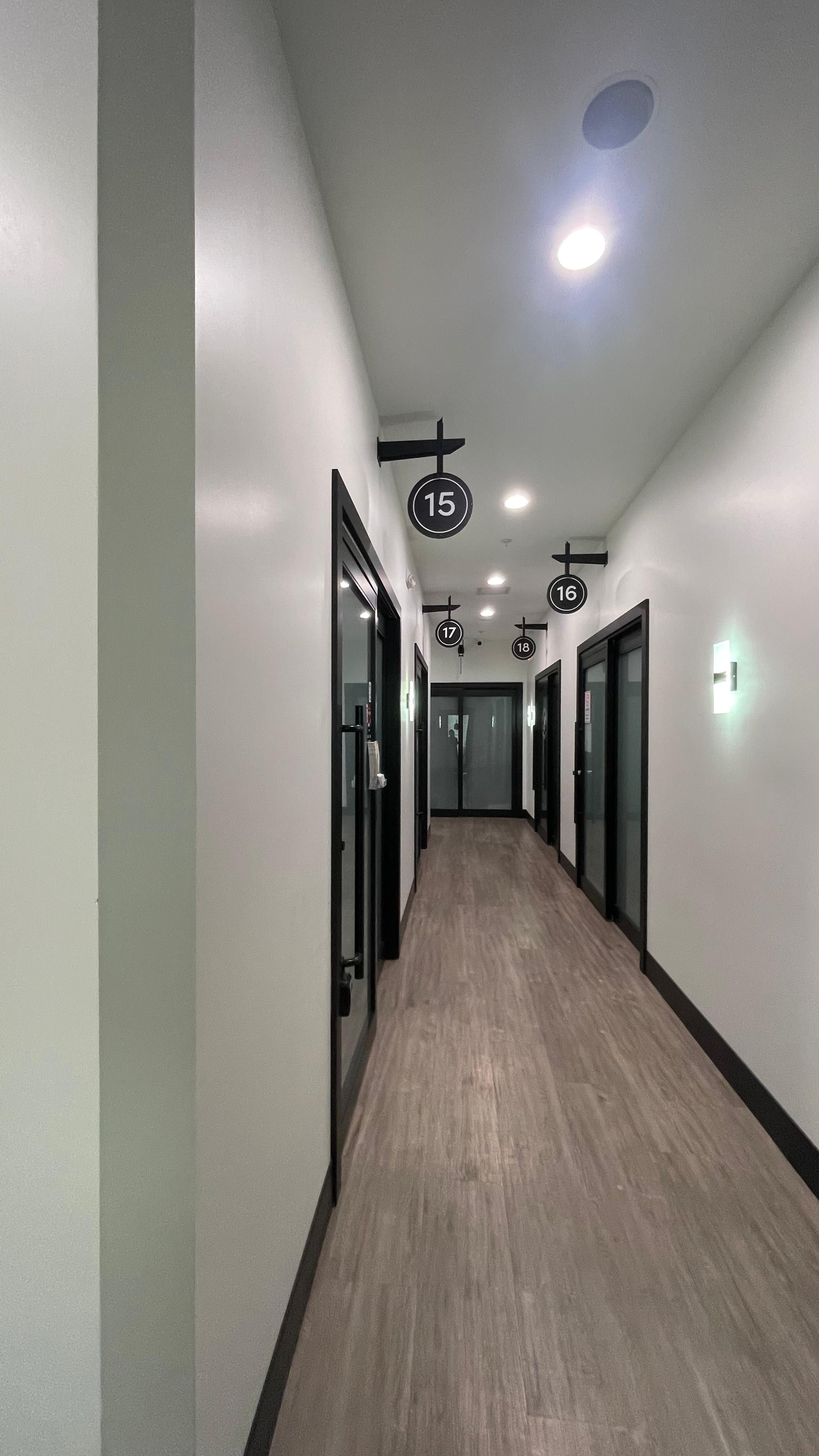 Sola Salons hallway with signs directing guests to room 17