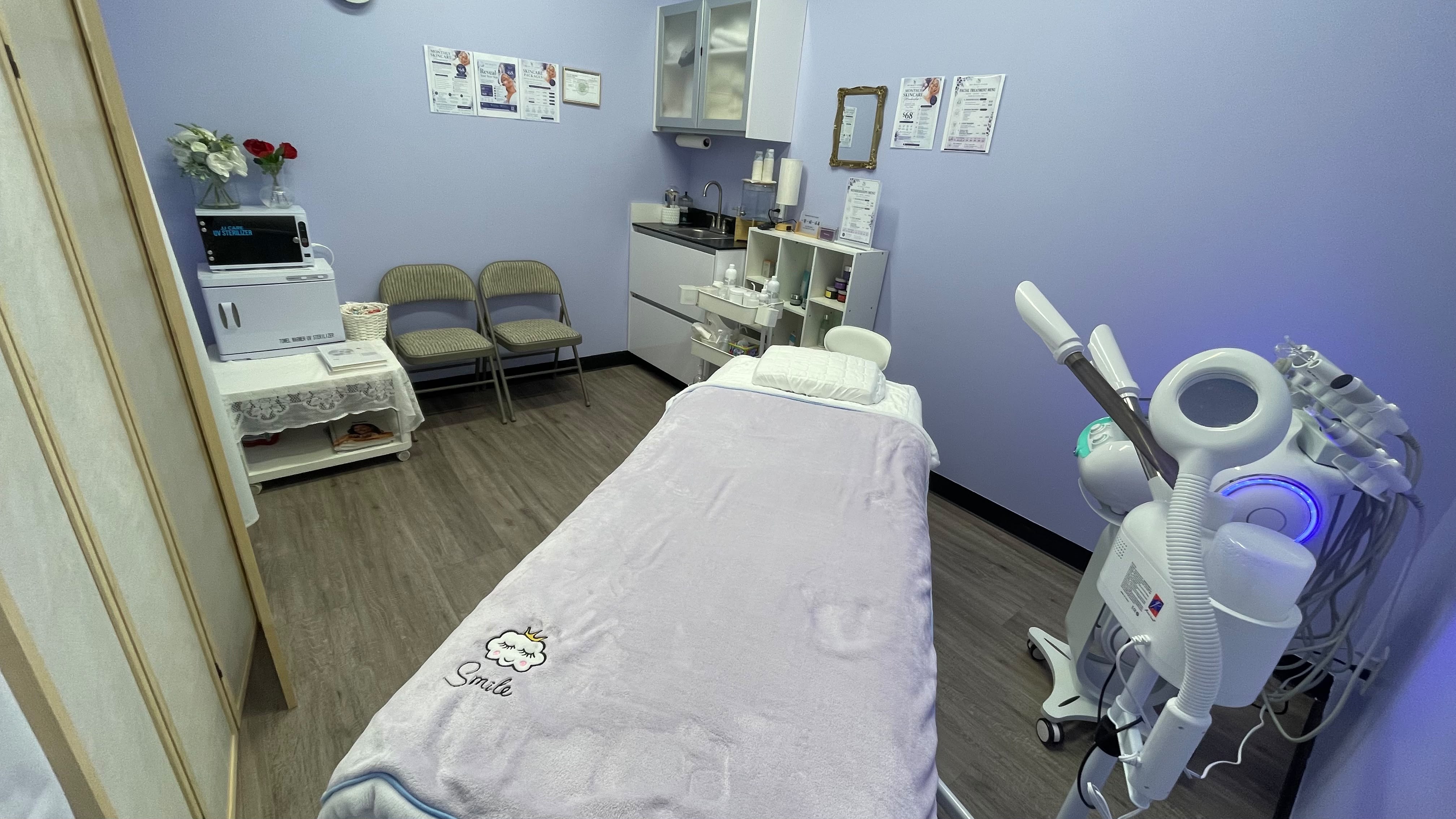Sky Beauty Studio treatment room with facial bed and professional equipment